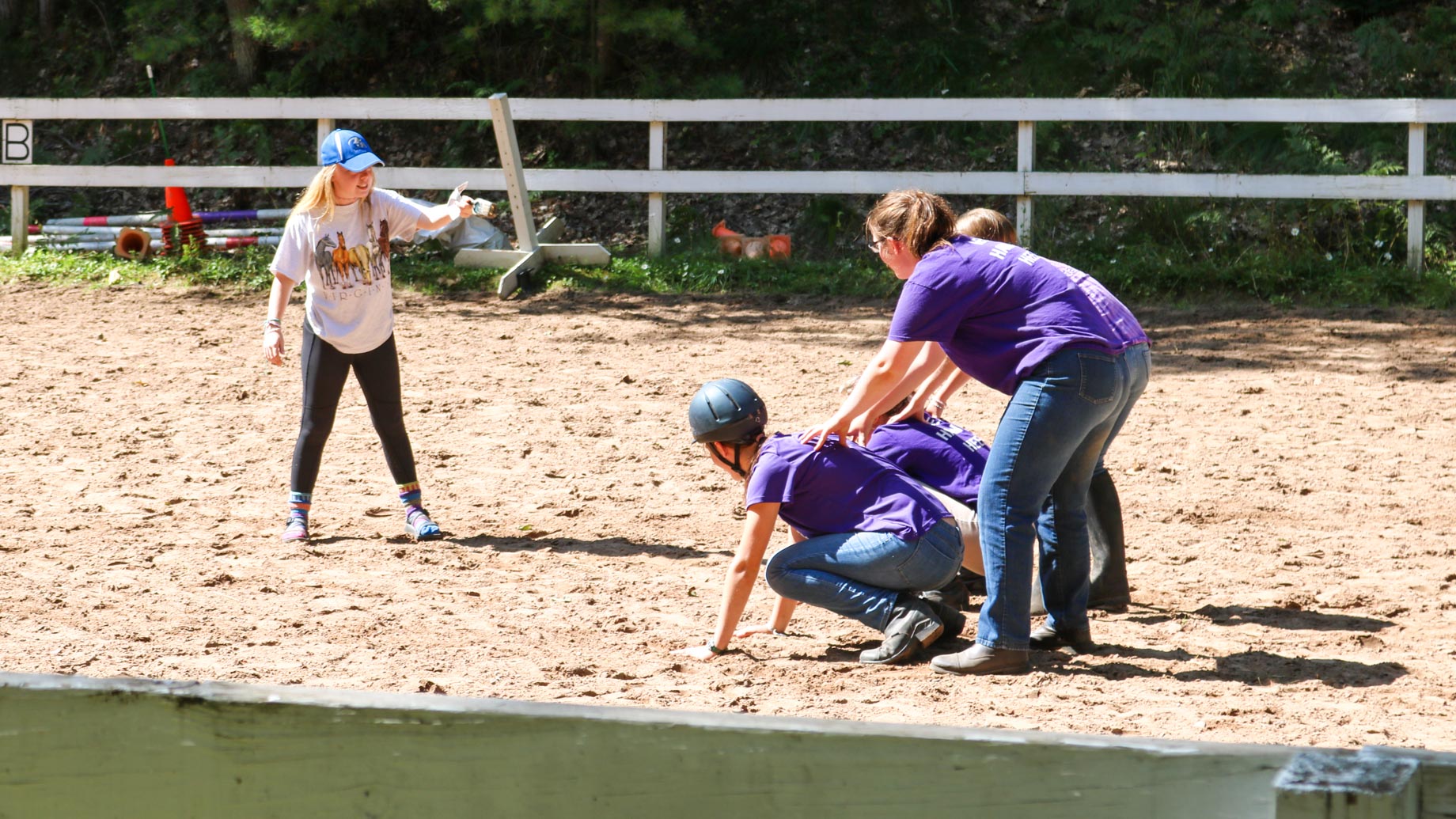 Campers participate in horseback riding exercise