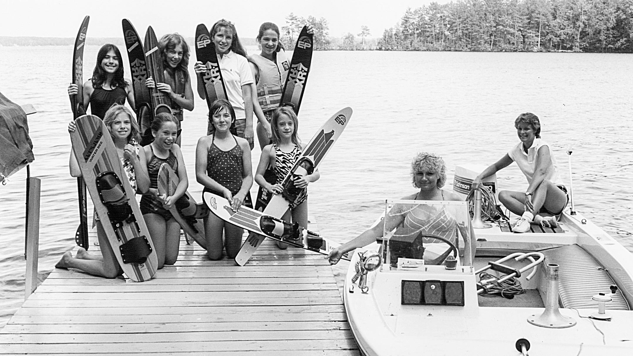 Black and white photo of camper preparing to waterski in 1983