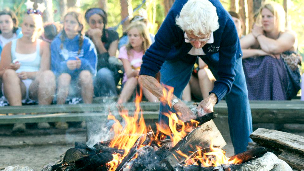 Annie B. lights camp council fire