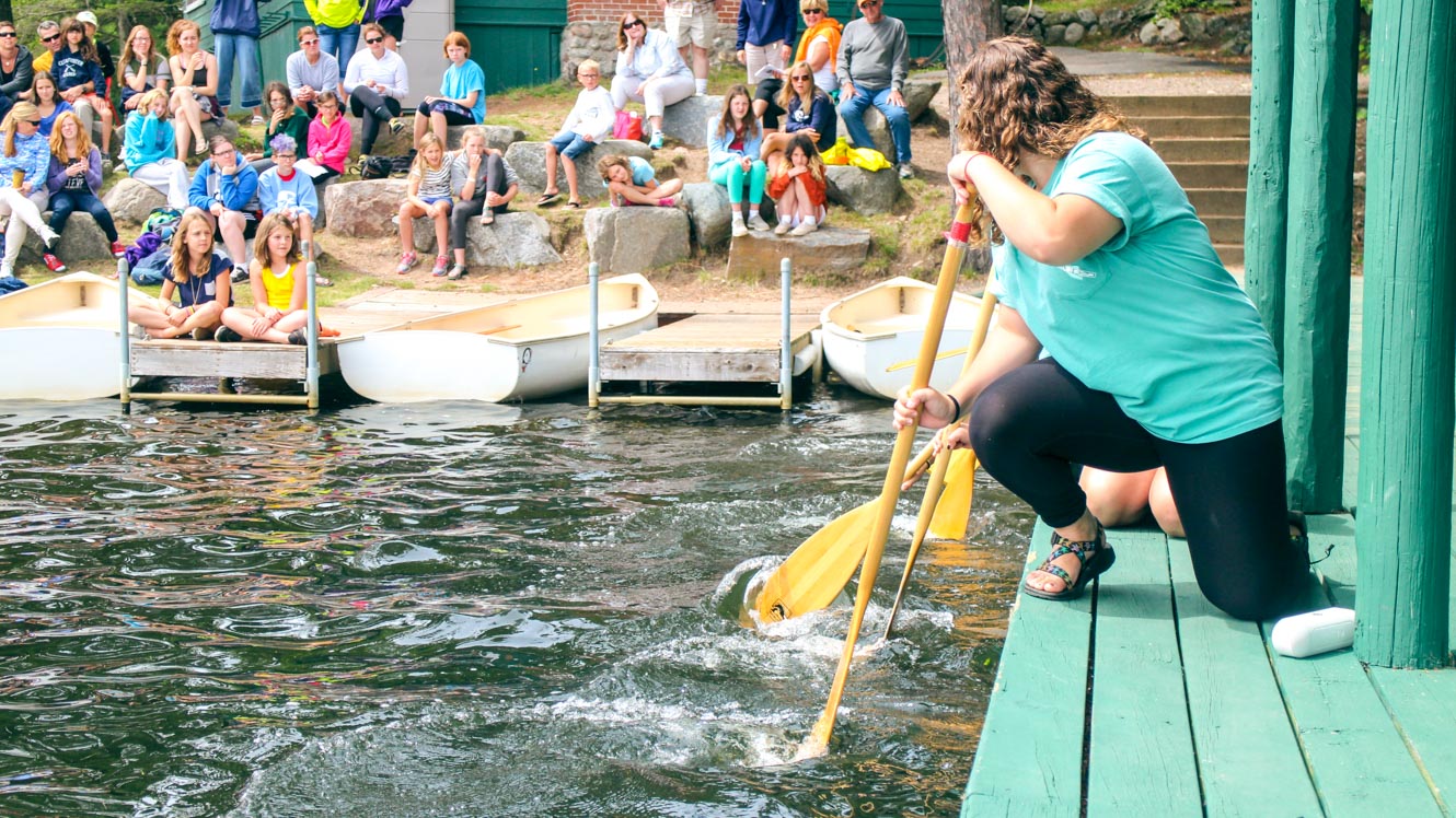 Counselors teach campers proper paddling