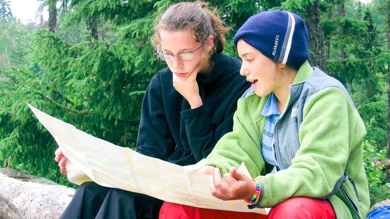 Two campers read a map