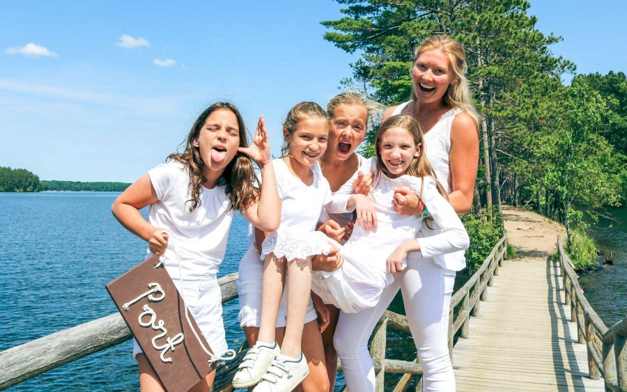 Cape cabin poses for silly group photo on camp bridge