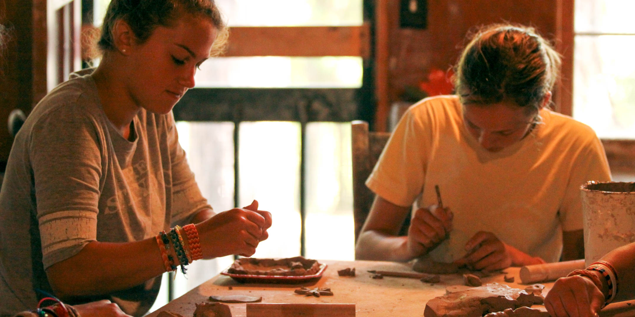 Two girls make ceramics at summer camp