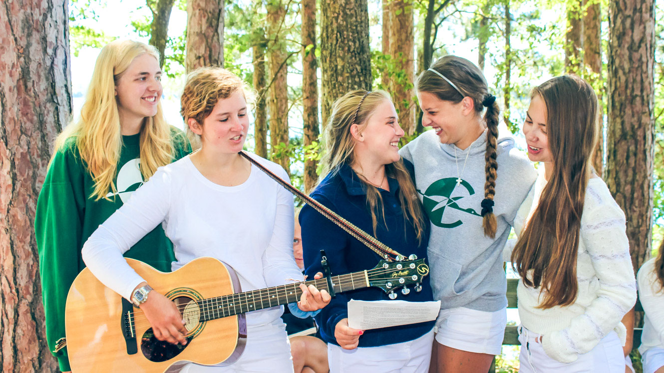 Campers perform with guitar during Clearwater Sunday Service