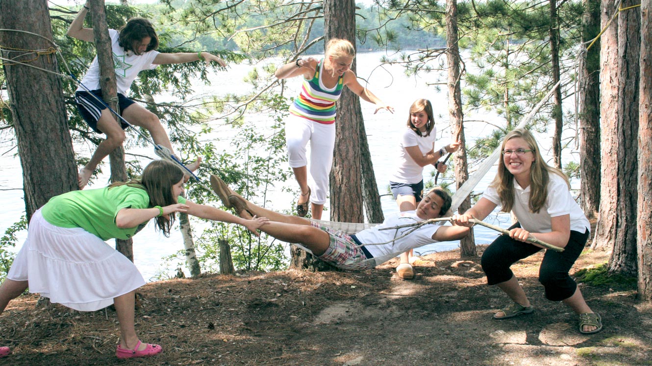 Campers pretend to attack sleeping girl in hammock