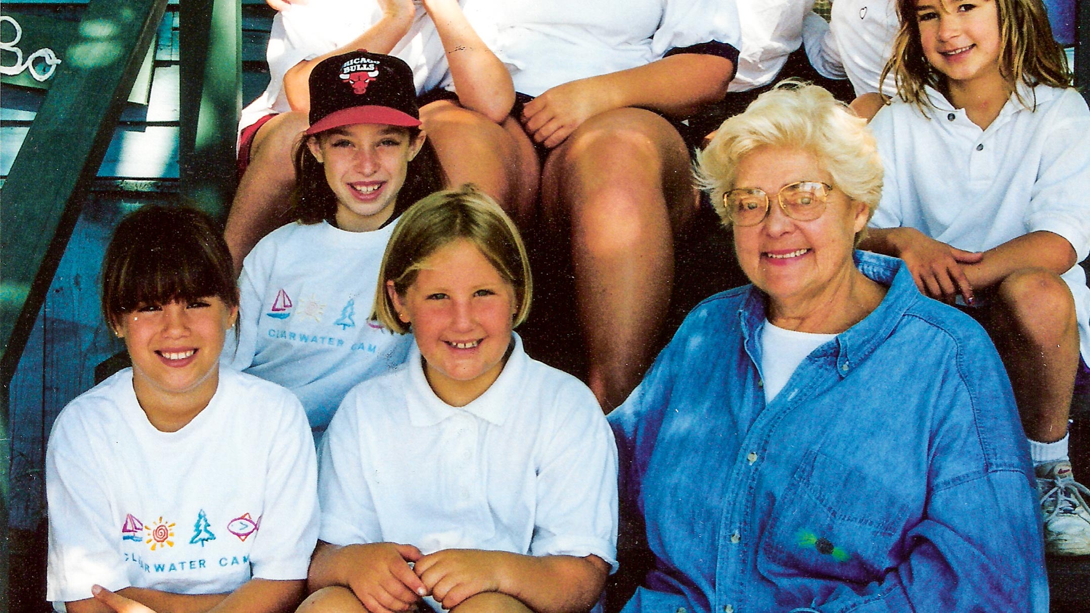 Director Sunny sits with group of campers